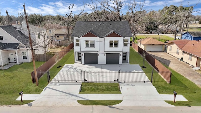 view of front facade featuring a garage and a front lawn