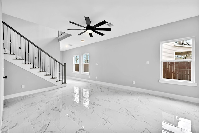 unfurnished living room with ceiling fan