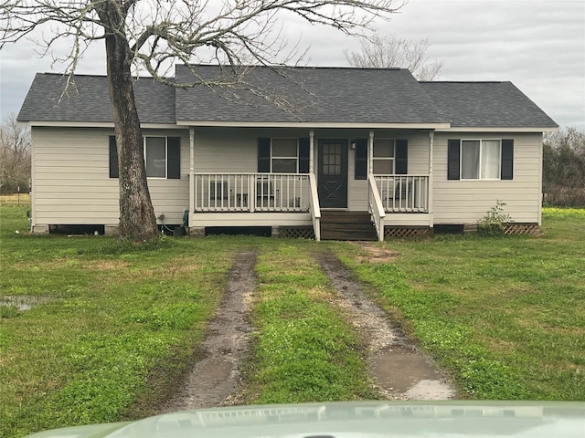 ranch-style house with a front yard and a porch