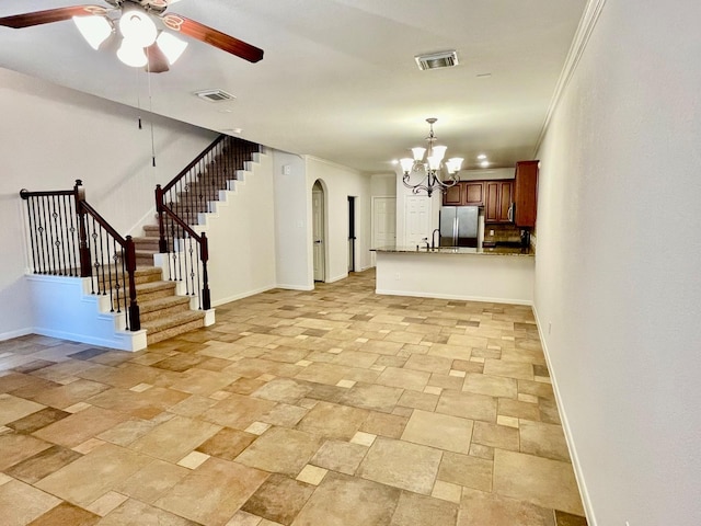 unfurnished living room with crown molding, sink, and ceiling fan with notable chandelier