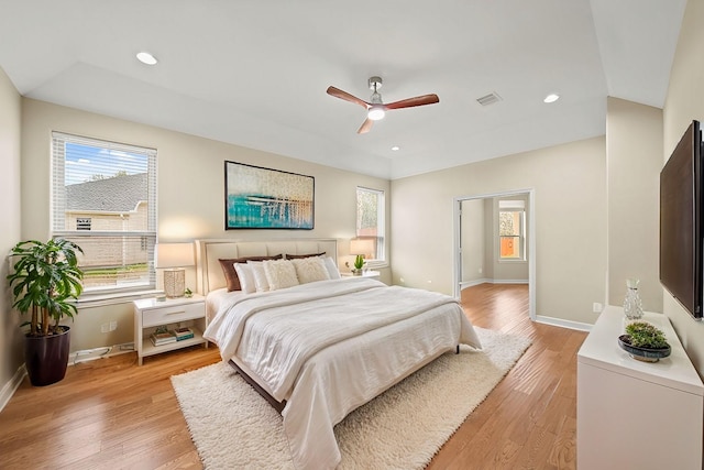 bedroom featuring baseboards, light wood finished floors, a ceiling fan, and recessed lighting