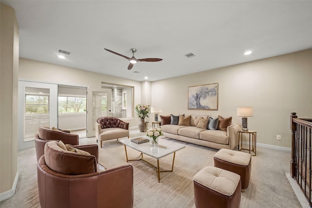 living area with ceiling fan, baseboards, light colored carpet, and recessed lighting