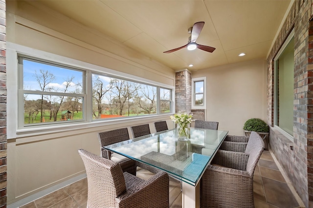 sunroom / solarium with ceiling fan