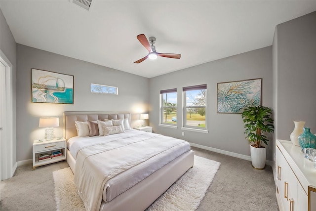 bedroom featuring light colored carpet and ceiling fan