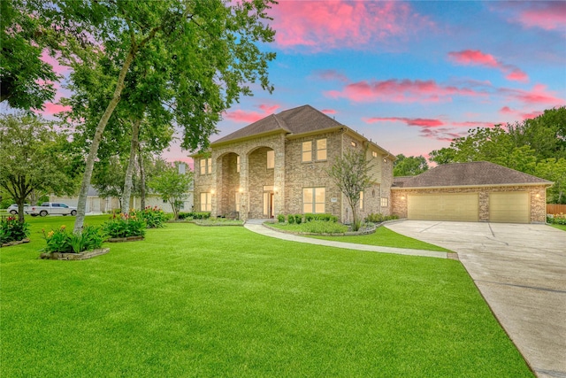 32603 Westminster Dr, Fulshear, TX 77441 - view of front facade with driveway, a yard, brick siding, and stone siding