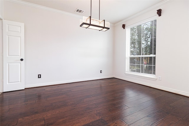 unfurnished dining area featuring dark wood-type flooring, ornamental molding, and an inviting chandelier