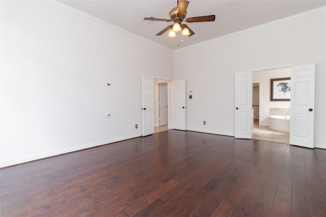 empty room with dark wood-type flooring, ornamental molding, and ceiling fan