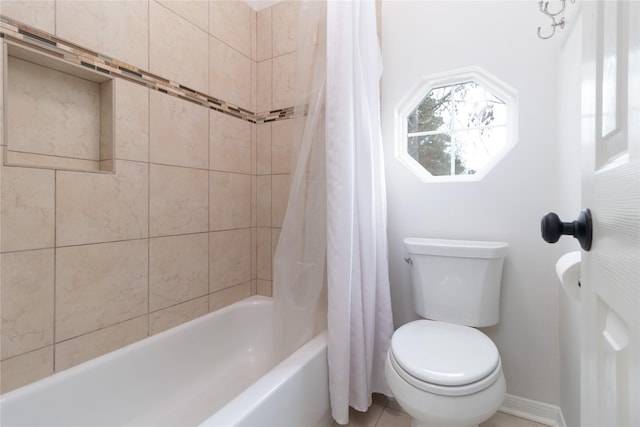 bathroom featuring toilet and shower / bath combo