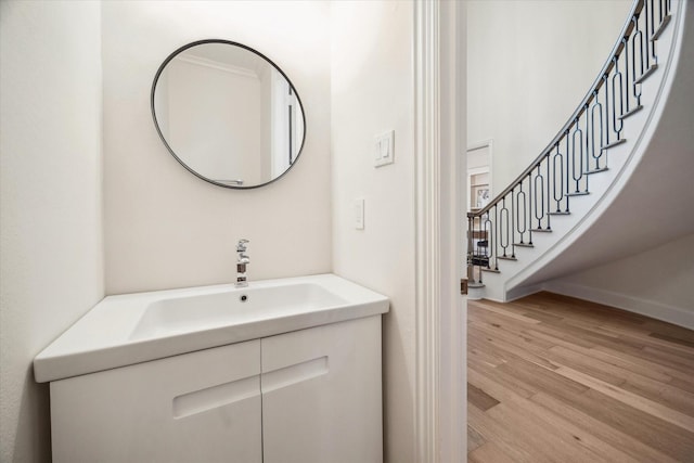 bathroom with vanity and hardwood / wood-style flooring