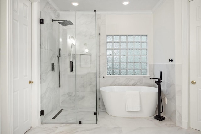 bathroom featuring ornamental molding, tile walls, and plus walk in shower