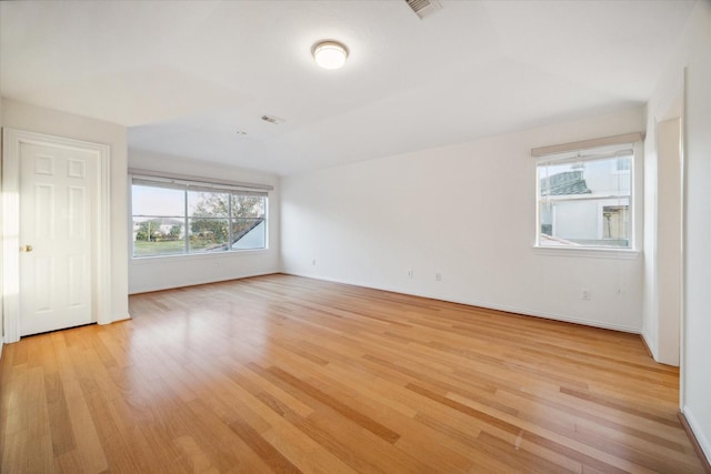 spare room featuring light hardwood / wood-style flooring