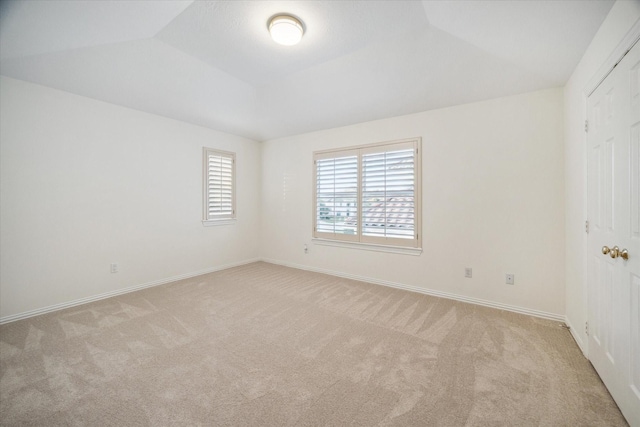 spare room with light carpet