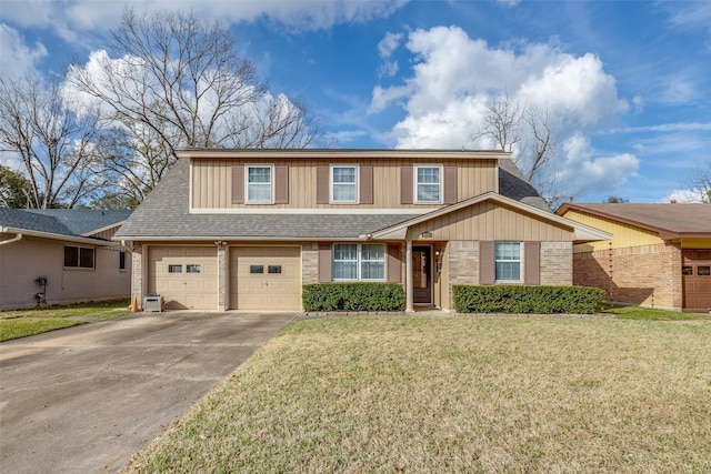 view of front of house with a garage and a front yard