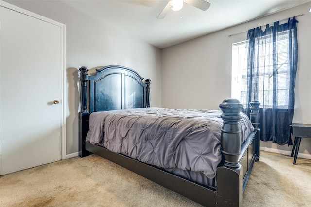 bedroom featuring ceiling fan and light colored carpet