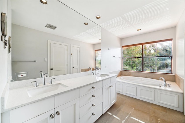 bathroom featuring vanity and a tub