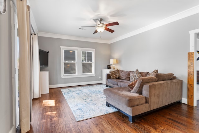 living room featuring ornamental molding, dark hardwood / wood-style floors, and ceiling fan