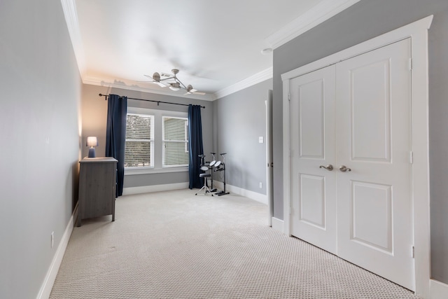 unfurnished bedroom featuring ornamental molding, light colored carpet, and a closet