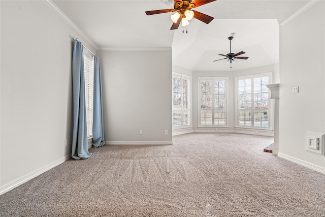 carpeted spare room featuring crown molding and ceiling fan