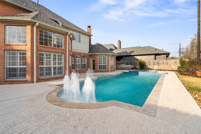 view of swimming pool featuring a patio area