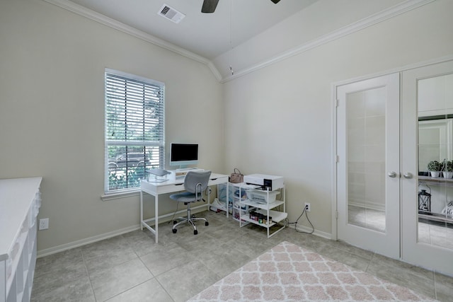 office space featuring french doors, ornamental molding, light tile patterned flooring, and vaulted ceiling