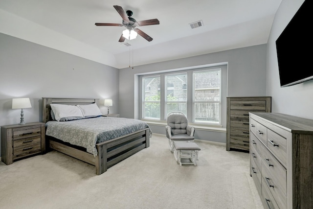 carpeted bedroom featuring vaulted ceiling and ceiling fan