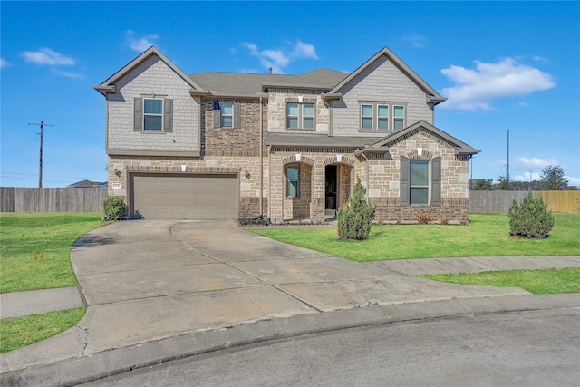 view of front of house with a garage and a front lawn