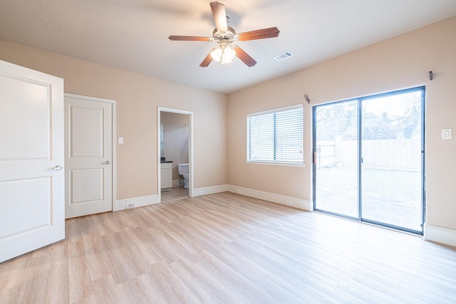 unfurnished bedroom featuring ceiling fan, connected bathroom, light wood-type flooring, and access to outside