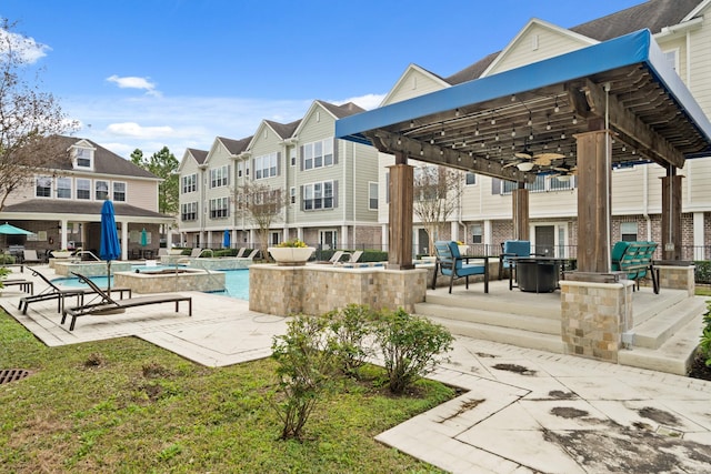 view of property's community featuring a pergola, a swimming pool, and a patio