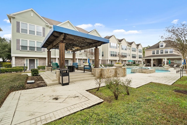 view of home's community featuring a pool, a gazebo, a patio area, and a yard