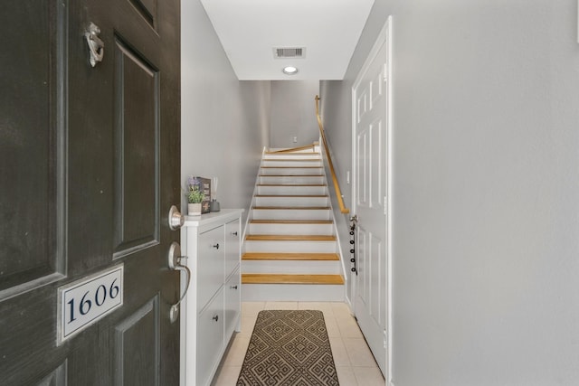 staircase with tile patterned flooring