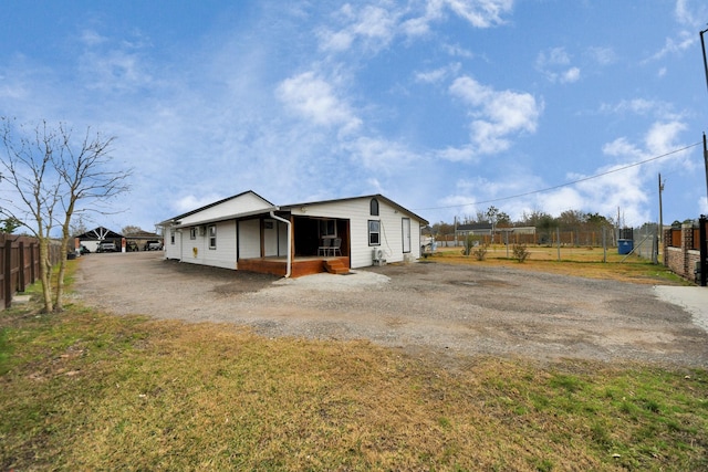 view of property exterior with a lawn