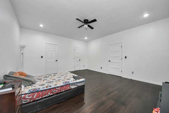 bedroom with dark wood-type flooring and ceiling fan