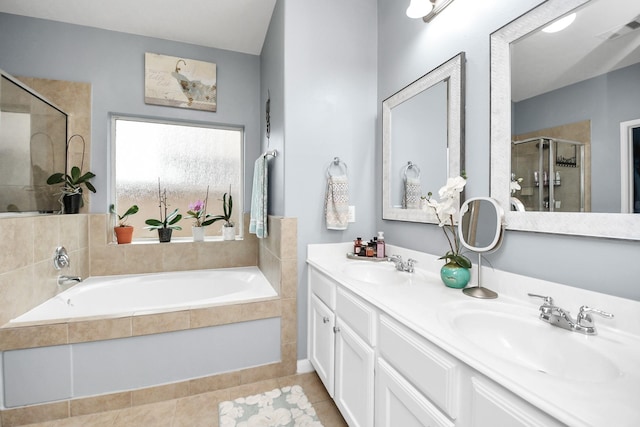 bathroom with vanity, tile patterned floors, and shower with separate bathtub