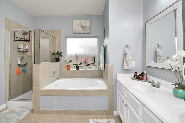 bathroom with vanity and separate shower and tub