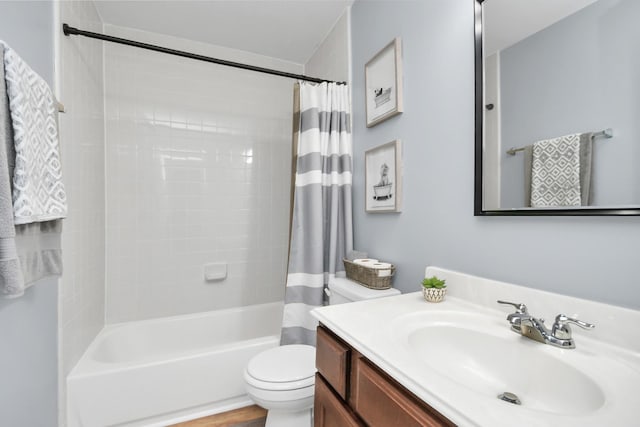 full bathroom featuring vanity, shower / bathtub combination with curtain, and toilet