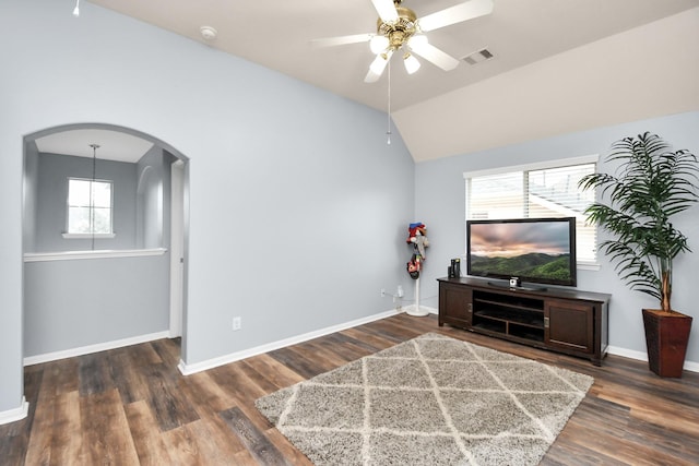 living room with ceiling fan, lofted ceiling, and dark hardwood / wood-style floors