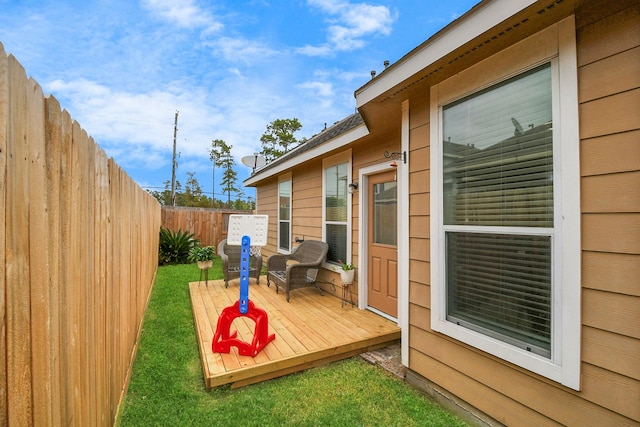 wooden deck with a yard