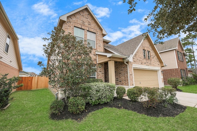 craftsman house with a garage and a front lawn