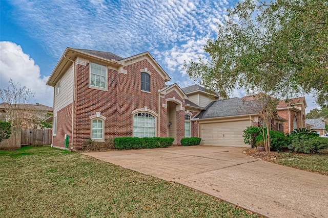 view of front of property with a garage and a front yard