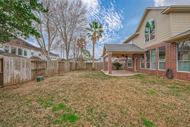 view of yard featuring a patio area and ceiling fan