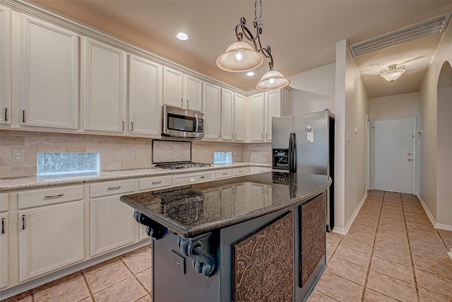 kitchen featuring stainless steel appliances, backsplash, light tile patterned flooring, and recessed lighting