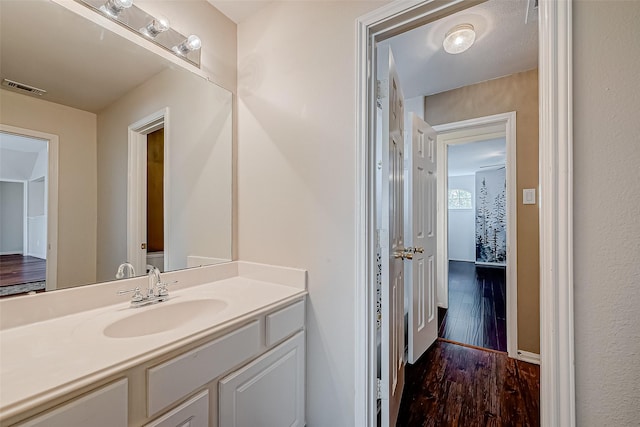 bathroom with wood-type flooring and vanity