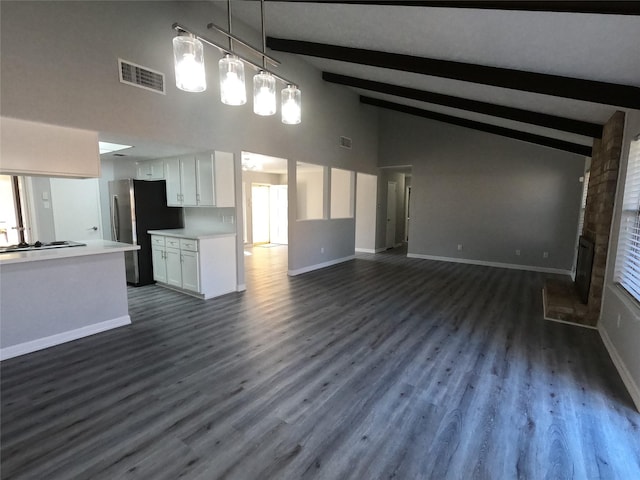 unfurnished living room featuring beam ceiling, a fireplace, high vaulted ceiling, and dark wood-type flooring