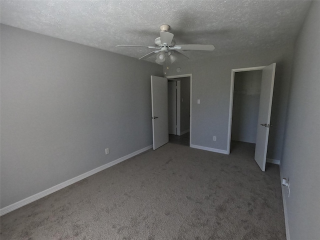 unfurnished bedroom with ceiling fan, a closet, a textured ceiling, and carpet flooring