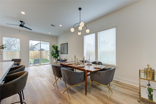 dining area with light wood-type flooring, visible vents, baseboards, and recessed lighting