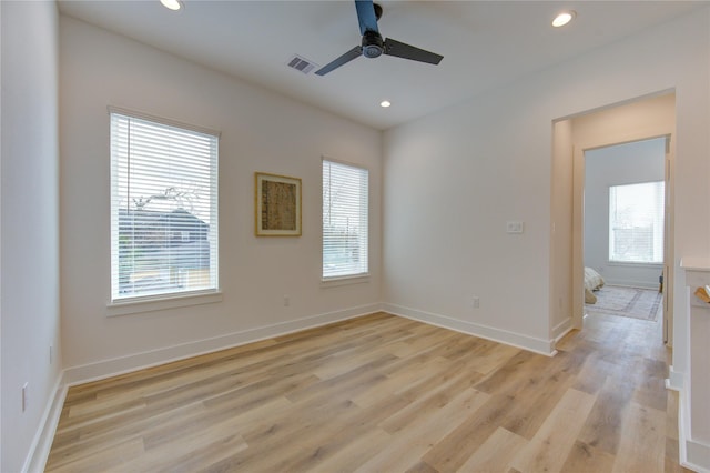 empty room featuring recessed lighting, visible vents, and a healthy amount of sunlight