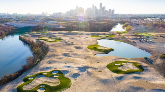 birds eye view of property featuring a water view, golf course view, and a city view