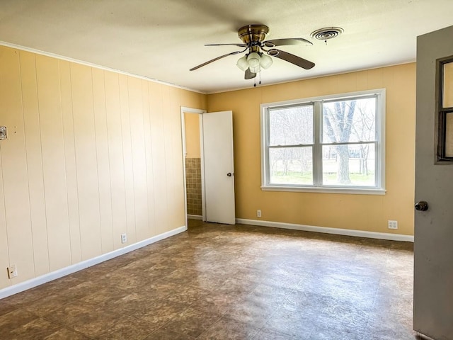 unfurnished room with ceiling fan