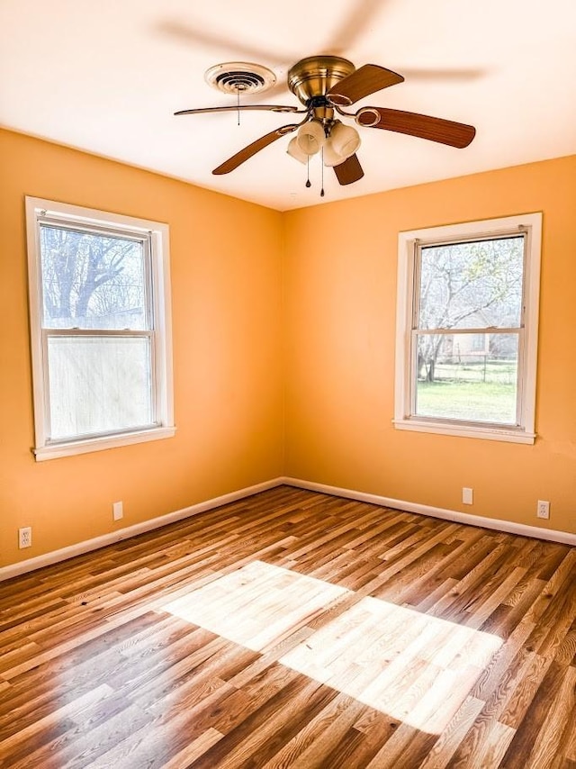 empty room featuring ceiling fan and light wood-type flooring