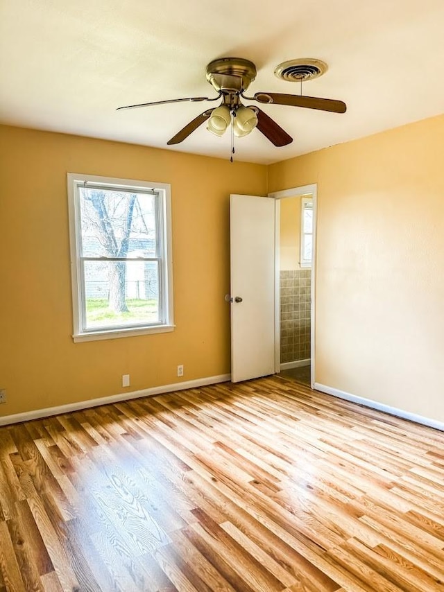 unfurnished bedroom featuring ceiling fan and light hardwood / wood-style floors